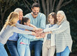 © Courtney/peopleimages.com - Where there is family, there is love. Shot of a family stacking their hands in the garden outside.