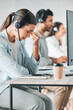 © Beaunitta V W/peopleimages.com - Some customers can be terrible on the phone. Shot of a young call centre agent looking stressed out while in an office with her colleagues in the background.