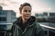 © Robert MEYNER - Portrait of a beautiful woman in a green jacket on the roof