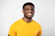 © Maria Vitkovska - Portrait of handsome smiling Nigerian student looking at camera isolated on white background. Education concept