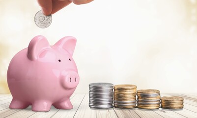 Poster - Saving Money. Hand putting coins in piggy bank