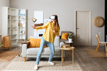 Wall Mural - Pretty young woman in VR glasses at home