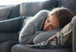 © Nina L/peopleimages.com - Life can be so bleak. Shot of a young woman lying on her couch feeling depressed.