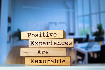 Poster - Wooden blocks with words 'Positive Experiences Are Memorable'.