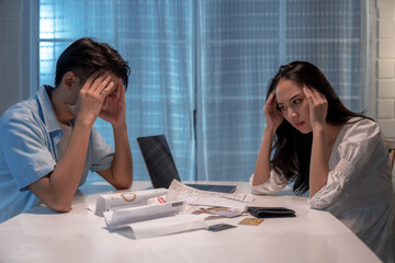 Wall Mural - Stressed Asian family due to debt problems.