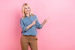 © deagreez - Photo of cheerful dreamy woman wear grey shirt pointing two fingers looking empty space isolated pink color background