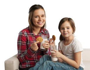 Poster - Happy mother and her daughter smiling while drinking milk and eating