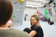 © Southworks - Multi-Cultural Group Of Friends Chatting By Climbing Wall In Indoor Activity Centre