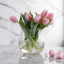 Pink Tulips In A Glass Vase On A Marble Floor