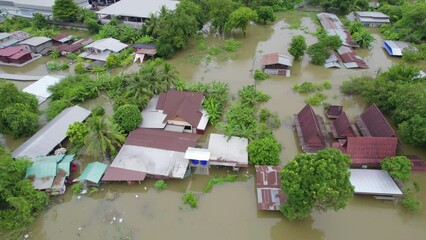 Wall Mural - High-angle view of the Great Flood, Meng District, Thailand, on October 3, 2023, is a photograph from real flooding. With a slight color adjustment