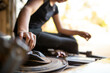 © Austockphoto - Close-up of female mechanic's hand fixing a car engine