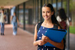 © Monkey Business - Portrait Of Female Secondary Or High School Student Outdoors At School Walking To Class