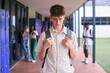 © Monkey Business - Unhappy Teenage Boy Outdoors At High School Being Teased Or Bullied