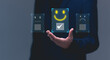 © Rawat - Customer service and Satisfaction concept, Businessman choosing on the happy Smile face icon to give satisfaction in service,  rating very impressed. review, feedback, best quality, good mood.