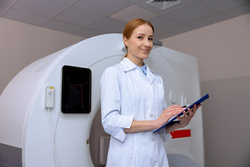 Female doctor in magnetic resonance imaging or computed tomography room of a modern hospital