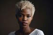 © Andrii  - Beautiful young African American woman with short dyed blond hair looking at camera. Generative AI