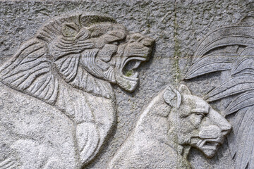 Wall Mural - A stone slab carved with a lion pattern