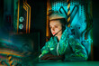© VISTA by Westend61 - Young gamer wearing headset playing video games on laptop at desk