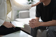 © mojo_cp - Professional psychologist conduct a consulting with sad patient in clinic..