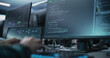 © Gorodenkoff - Close Up of a Software Developer Working on a Desktop Computer, Programming Code Running on Display. Specialist Typing on Keyboard, Coding and Implementing a Technical Feature
