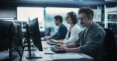 Aufkleber - Portrait of a Focused Computer Engineer Working in a Technological Office Facility. Research and Development Department Writing Software Code for an Innovative Online Program for a Global Enterprise