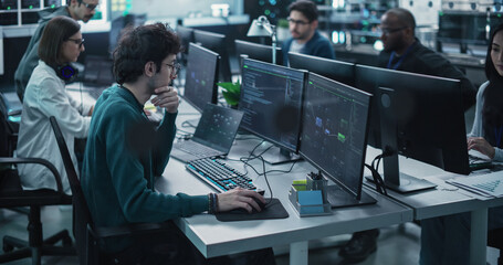 Poster - Team of Talented Young Professionals Working in a Technological Research and Development Facility. Diverse Specialists Using Computers, Writing Code, Planning Innovative Information Technology Project
