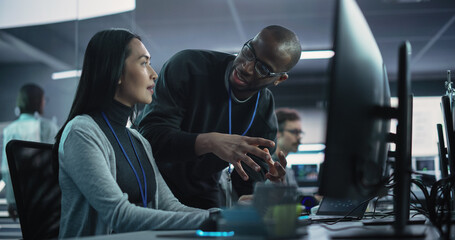 Aufkleber - Two Diverse Multiethnic Colleagues Having a Conversation While Busy Working on a Team Project. Asian Female Designer Talking with an African Project Manager. Teamwork in Technology Laboratory