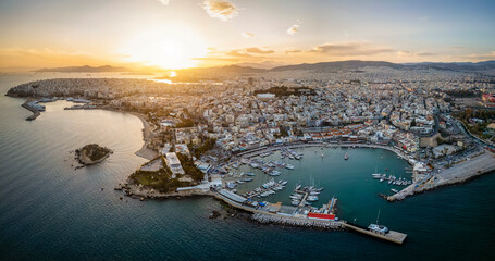 Wall Mural - Aerial sunset panorama of the Piraeus district in Athens, Greece, with Mikrolimano and Zea Marina and the ferry boat harbour in the background