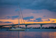 Sunset sky behind the John Ringling Causeway Bridge over Sarasota Bay in Sarasota Florida USA