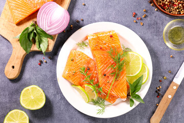 Wall Mural - fresh salmon fish fillet with dill and lemon on plate