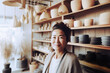 © TRINETTE + CHRIS - Portrait of Japanese small business woman owner in home goods retail store. Generative AI.