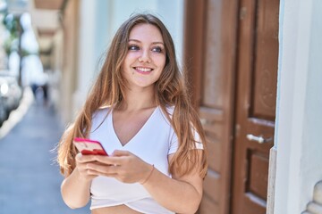 Sticker - Young blonde woman smiling confident using smartphone at street