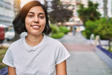 Sticker - Young latin woman smiling confident standing at street