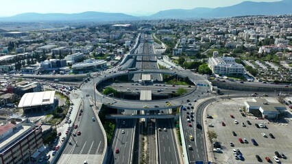 Wall Mural - Aerial drone time lapse video of ring road junction passing through Marousi residential area connecting Attiki odos highway and Kifisias Avenue, Attica, Greece