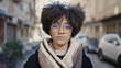 © Krakenimages.com - Young african american woman standing with serious expression at street