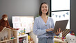 © Krakenimages.com - Young beautiful hispanic woman working as a teacher using laptop at kindergarten