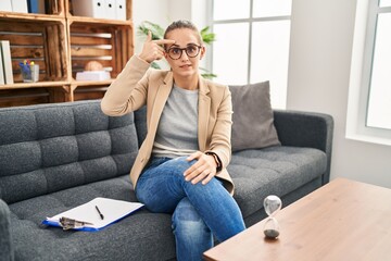 Canvas Print - Young woman working at consultation office pointing unhappy to pimple on forehead, ugly infection of blackhead. acne and skin problem