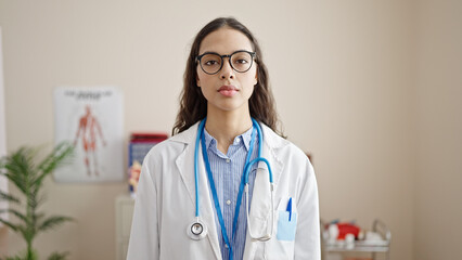 Sticker - Young beautiful hispanic woman doctor smiling confident standing at clinic