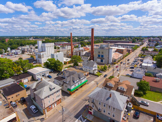 Historic mill factory aerial view on Broad Street with Blackstone River at the background in city center of Central Falls, Rhode Island RI, USA. 