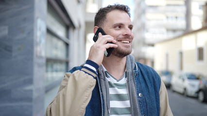 Sticker - Young caucasian man smiling speaking on the phone at street