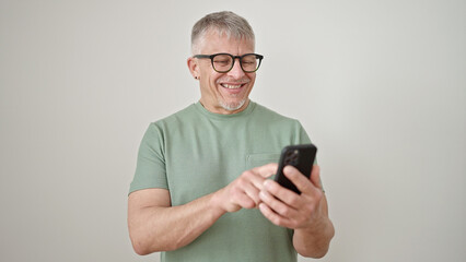 Poster - Middle age grey-haired man smiling confident using smartphone over isolated white background