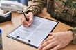 © Krakenimages.com - Young arab man army soldier signing contract at office