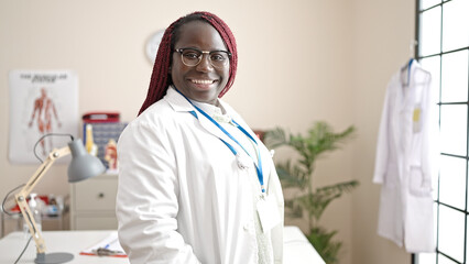 Sticker - African woman with braided hair doctor smiling confident standing at clinic