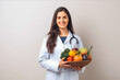© VisualProduction - Beautiful nutritionist smiling at camera. Female nutritionist with fruit and vegetables on table. Generative AI