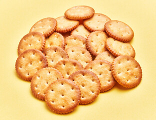 Wall Mural -  Delicious group of salty biscuits over isolated yellow background