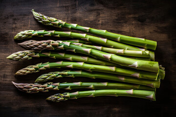 Raw asparagus spears of great quality in a wood corner.