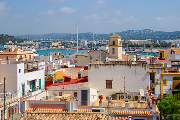 Wall Mural - Aerial view of the city center of Eivissa, the capital of Ibiza in the Balearic Islands, Spain, with the bell tower of the San Salvador de la Marina church