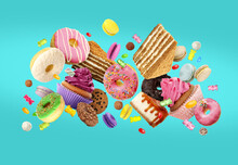 Many Delicious Sweets Falling On Dark Turquoise Background