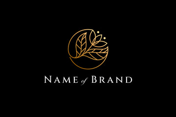 Wall Mural - Floral logo in luxury gold color in circle shape linear design style