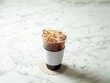 © mnimage - Iced Americano in a take-out container